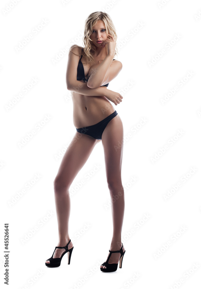 young blond woman stand in black sexy lingerie