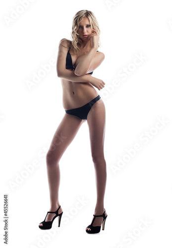 young blond woman stand in black sexy lingerie