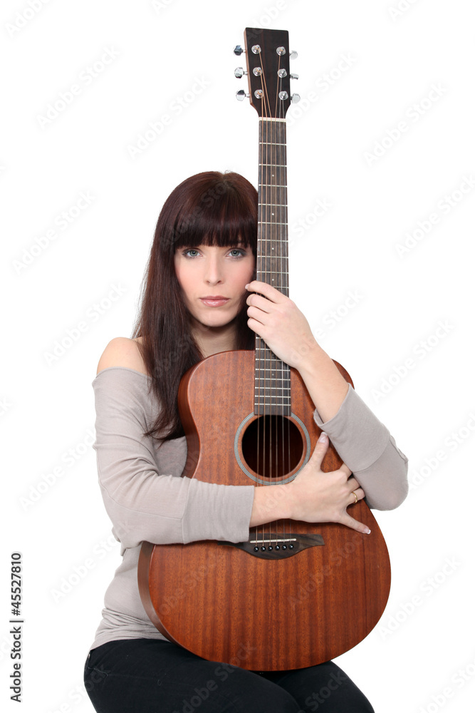 Brunette woman with guitar