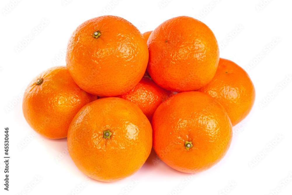 Group of ripe tangerine or mandarin with slices on white Group of ripe tangerine or mandarin with slices on white