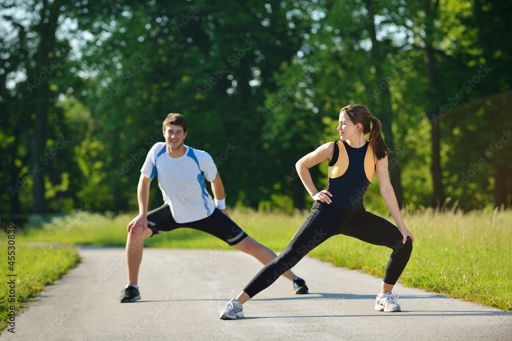 people doing stretching exercise after jogging people doing stretching exercise after jogging