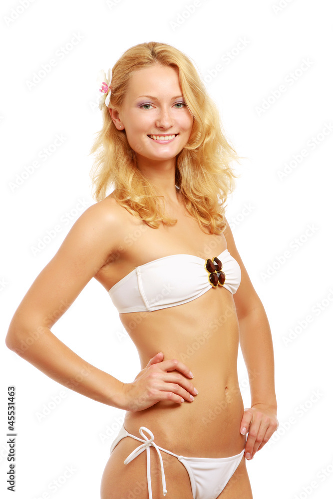 Obraz premium A portrait of beautiful smiling woman in white swimsuit