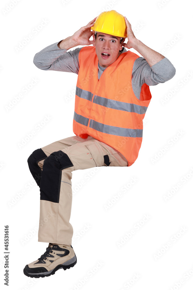 Workers sitting in a gesture of fright Workers sitting in a gesture of fright
