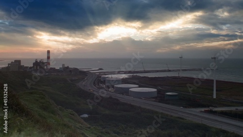 A road and windmills during sunset, made with a wide angle lens photo