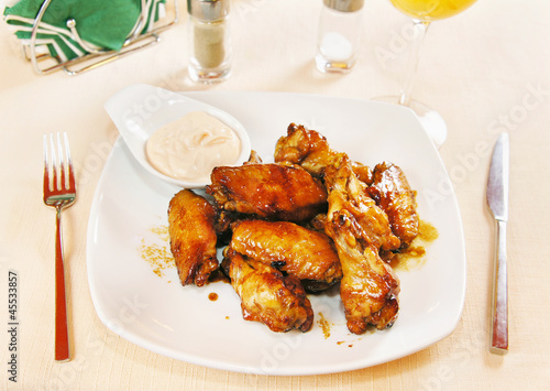 Chicken wings in wine sauce on a plate
