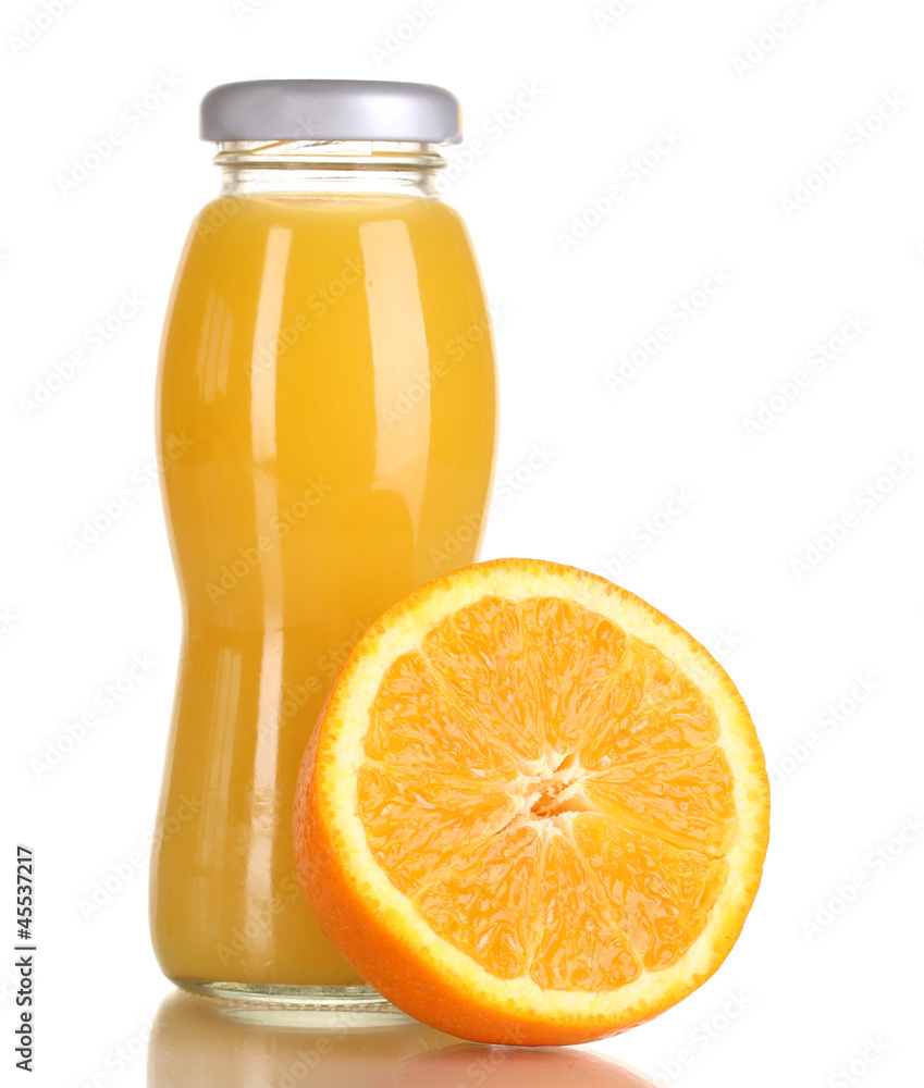 Delicious orange juice in a bottle and orange next to it Delicious orange juice in a bottle and orange next to it