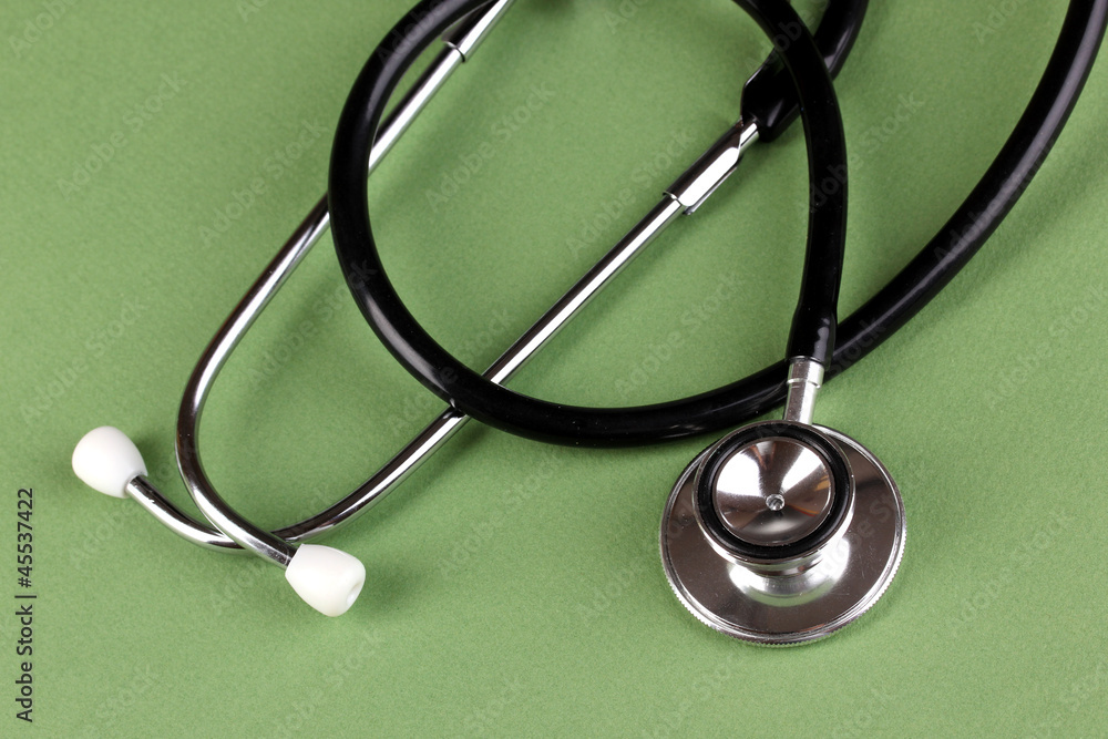 Stethoscope on green background Stethoscope on green background
