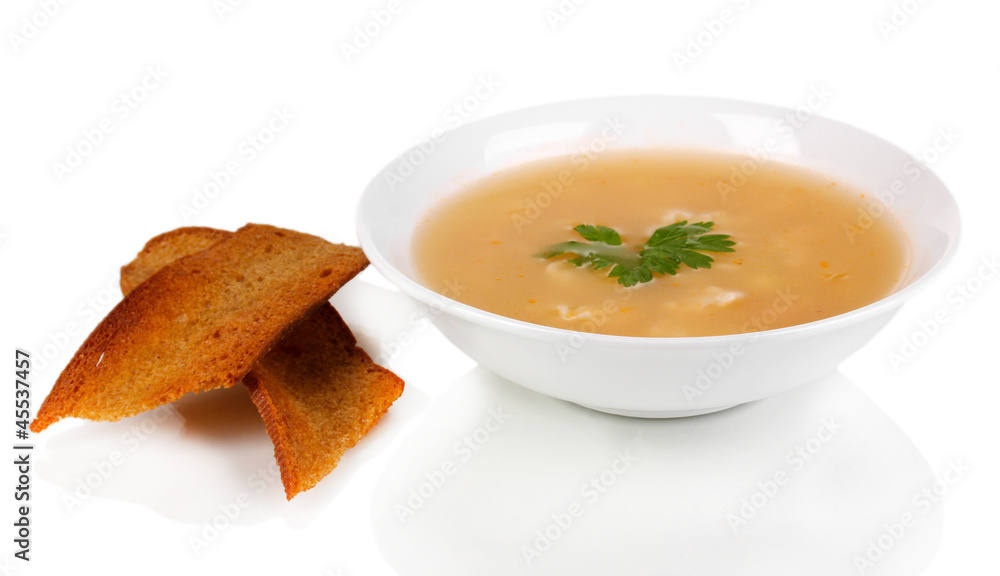 Fragrant soup with garlic croutons isolated on white Fragrant soup with garlic croutons isolated on white