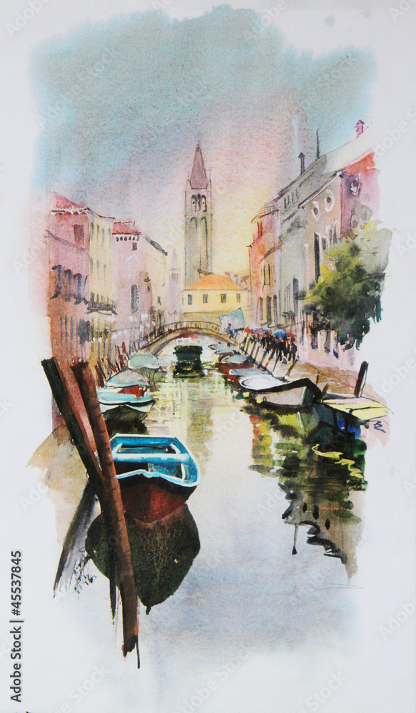 Fototapeta premium A view of the canal with boats and buildings in Venice
