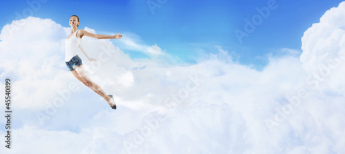 Modern style dancer against blue sky