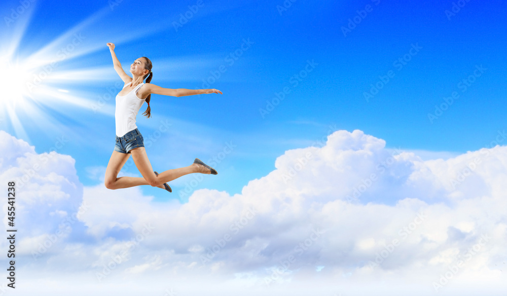 Modern style dancer against blue sky Modern style dancer against blue sky