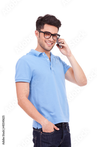 young man on the phone is smiling