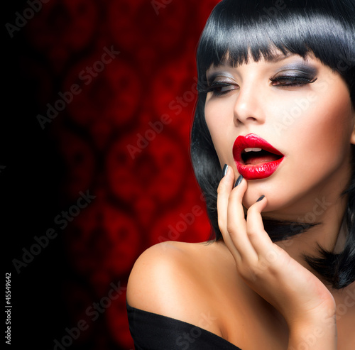 Beautiful Brunette Girl Portrait.Makeup. Sensual Red Lips