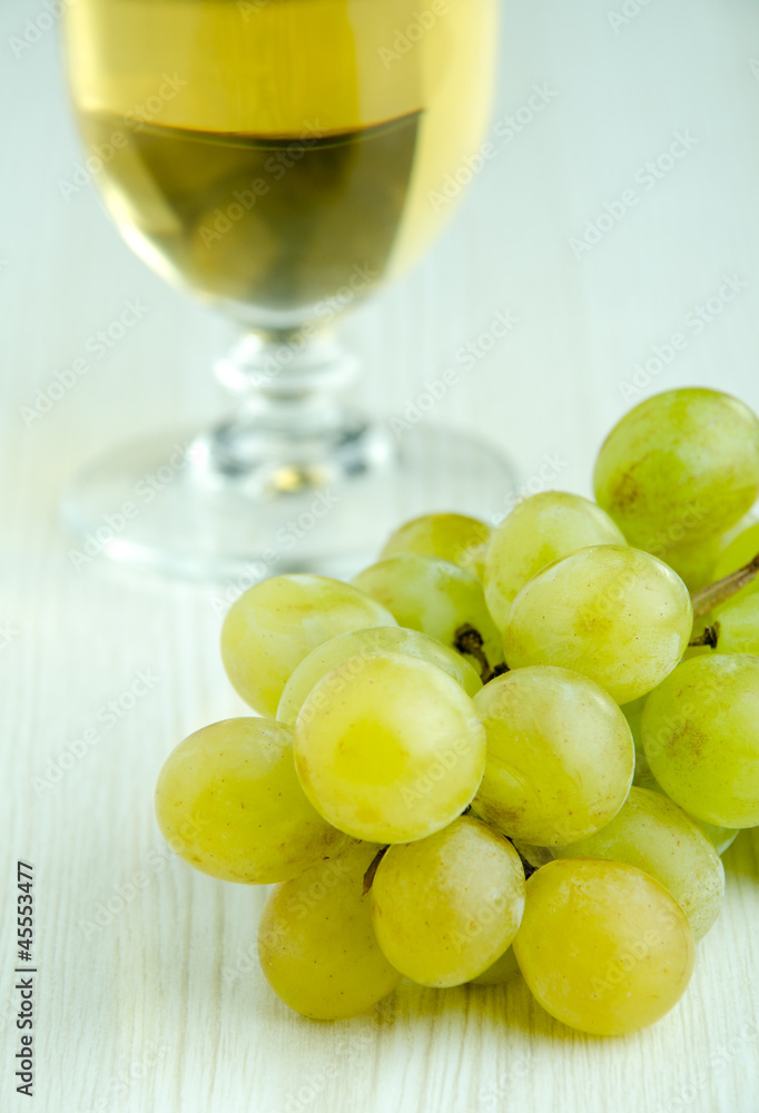 Fresh grapes and glass of white wine Fresh grapes and glass of white wine