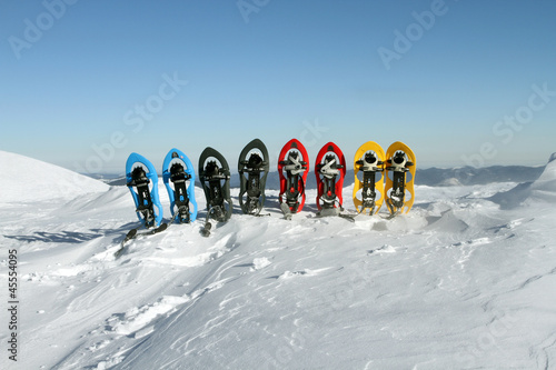 Snowshoeing. Snowshoes in the snow. photo