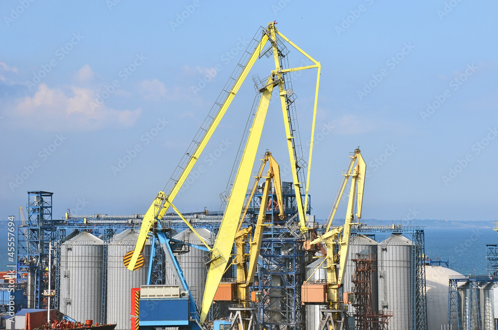 Cargo crane and grain dryer in port Odessa, Ukraine Cargo crane and grain dryer in port Odessa, Ukraine