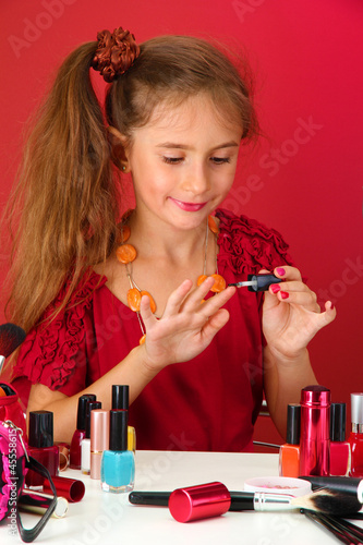 little girl in her mother's...