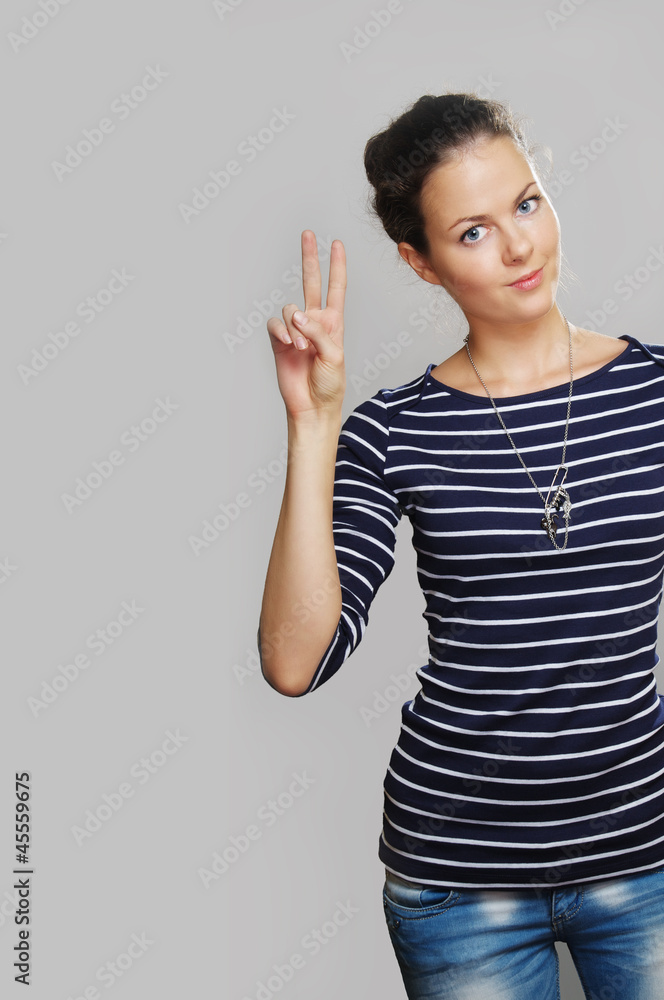 girl shows two fingers girl shows two fingers