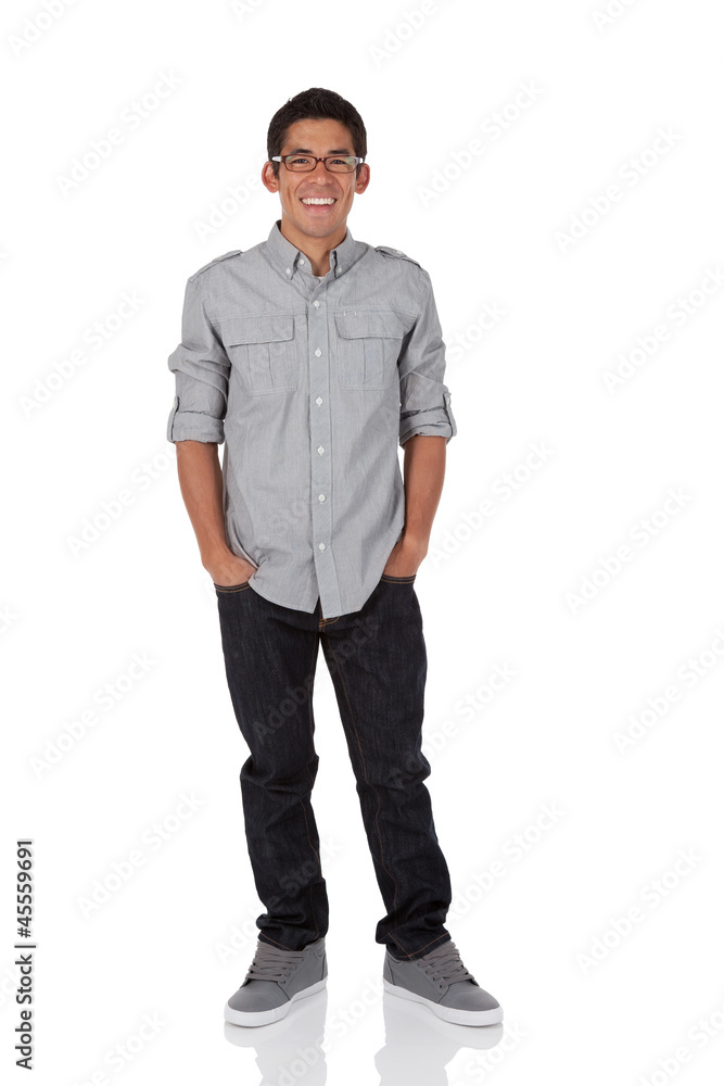 College age man standing with hands in pocket College age man standing with hands in pocket