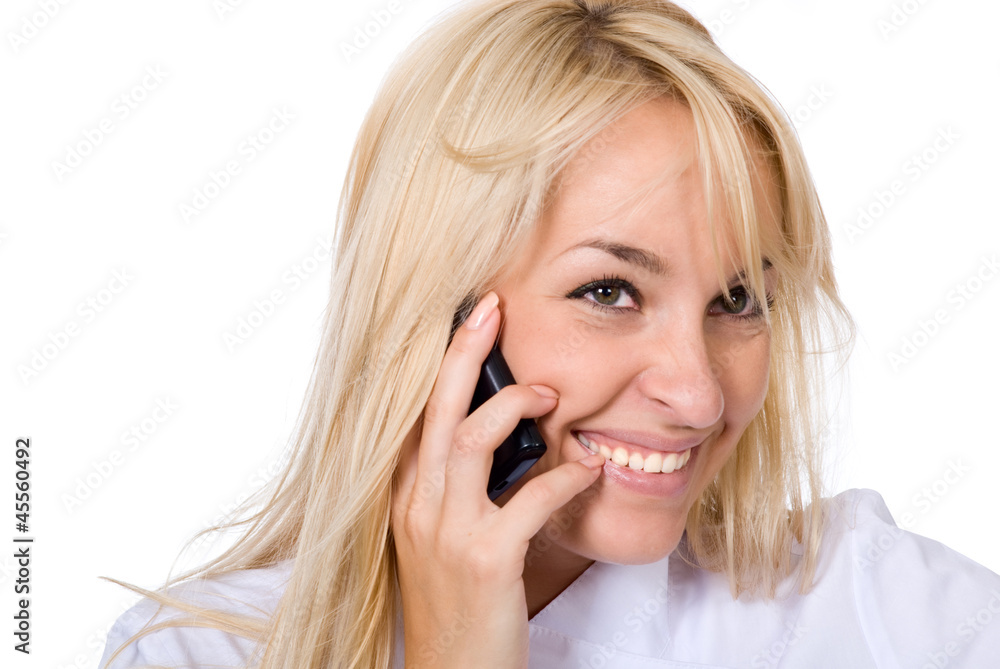 Young smiling beautiful doctor talks by mobile phone Young smiling beautiful doctor talks by mobile phone