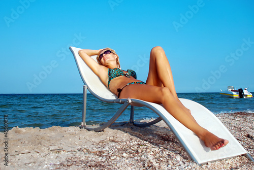 Beautiful woman having a rest on seacoast