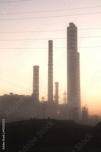 energy plant lighed in the sunset photo