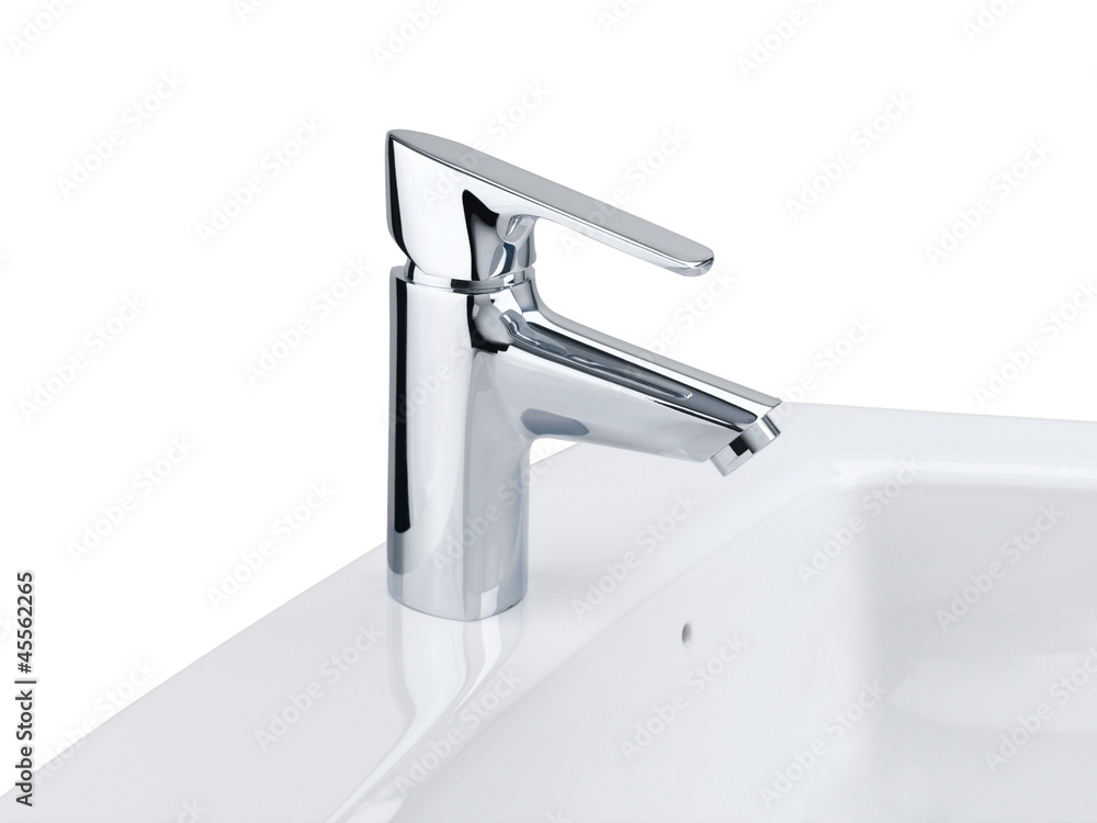 Nice design of the chrome faucet and white washbasin Nice design of the chrome faucet and white washbasin