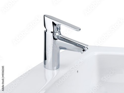 Nice design of the chrome faucet and white washbasin