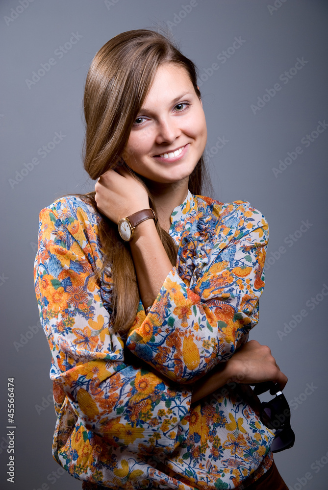 Portrait of a beautiful girl with sunglasses in hand Portrait of a beautiful girl with sunglasses in hand