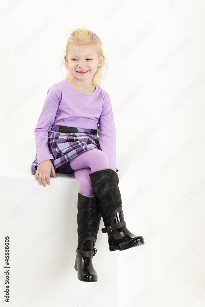 sitting little girl wearing a skirt