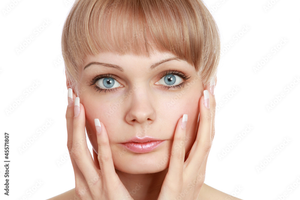Closeup portrait of a young woman touching her face Closeup portrait of a young woman touching her face