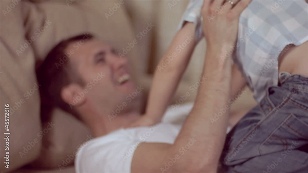 Father playing with his baby Father playing with his baby