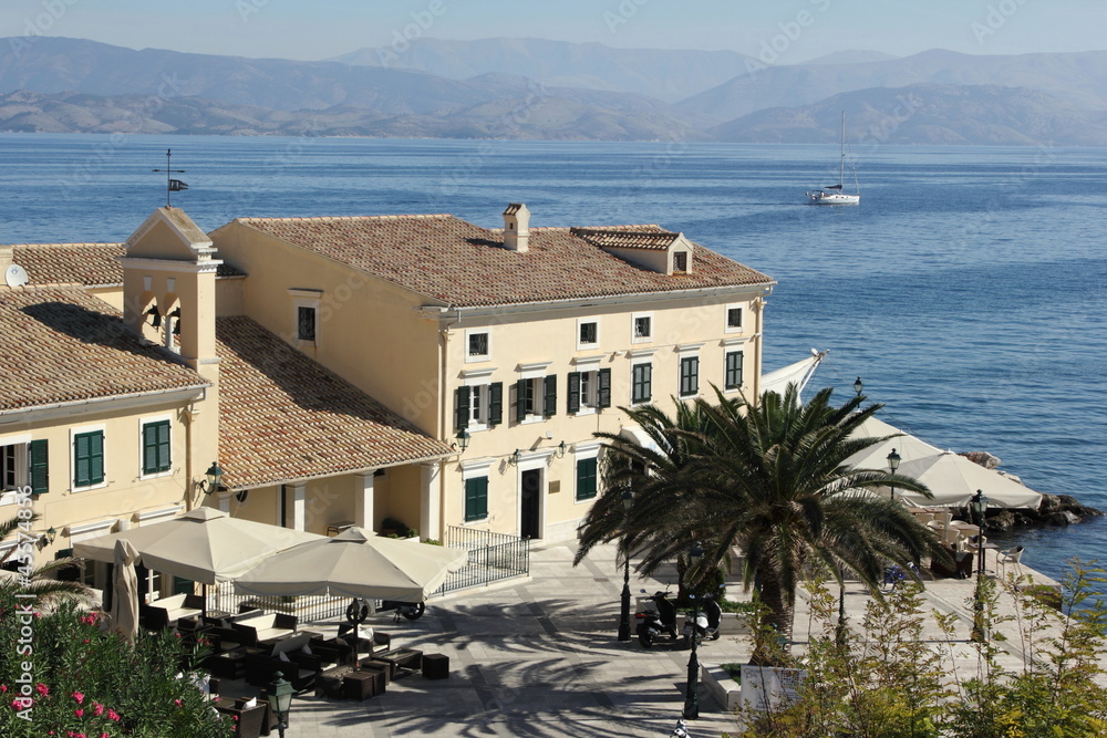mediteranean  building with blue sea and mountain background