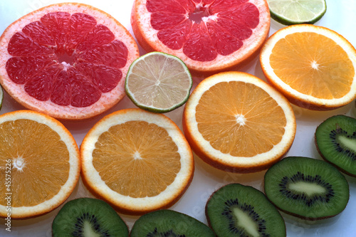 Mix of colorful citrus fruit on white