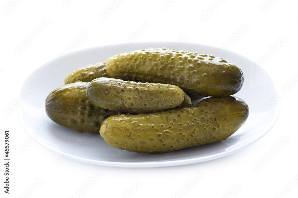 gherkin or gerkins in a dish isolated gherkin or gerkins in a dish isolated