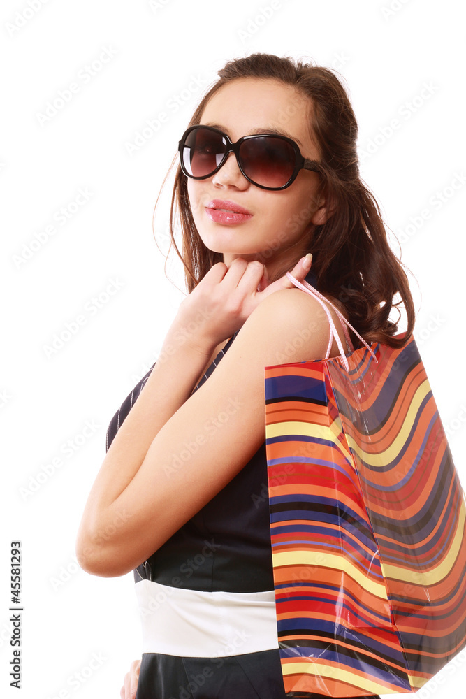 Fototapeta premium A fashionable woman with a bag, isolated on white
