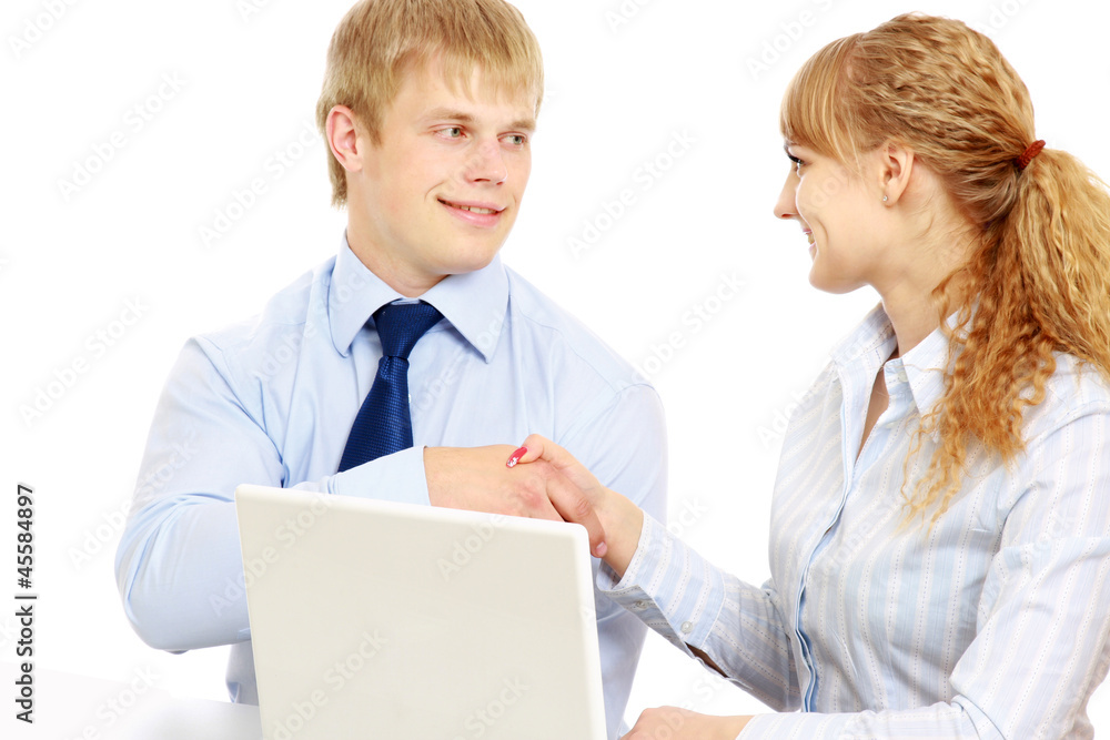 Businesspersons working at the desk with a laptop Businesspersons working at the desk with a laptop