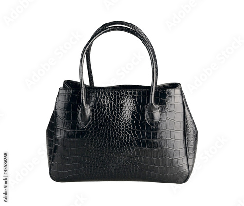 Beautiful black leather handbag made from crocodile leather isol