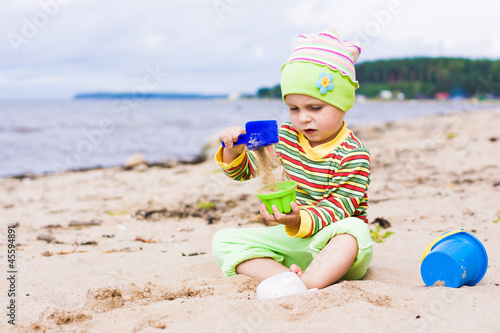 Kid playing on the beach