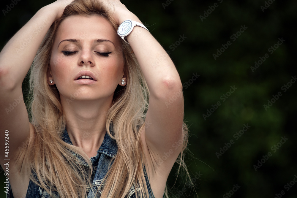 portrait of a beautiful girl outdoor with eyes closed