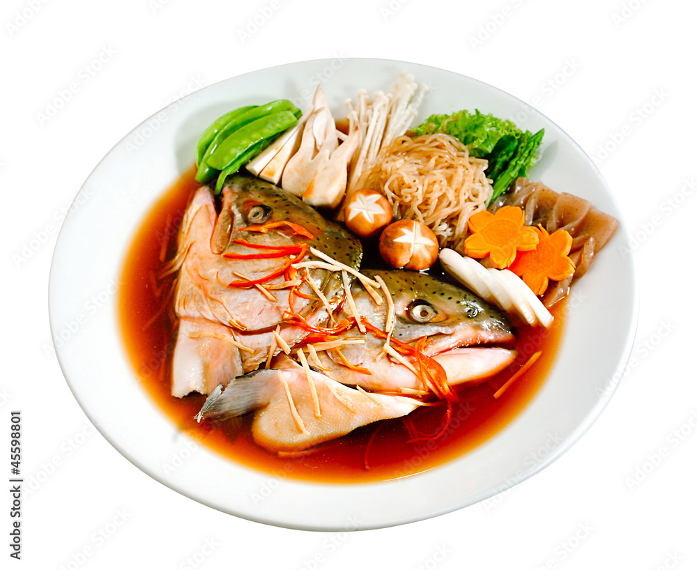 Japanese boiled fish with gravy and vegetables on white Japanese boiled fish with gravy and vegetables on white