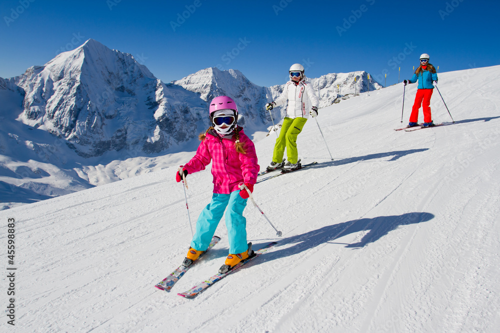 Skiing, winter, ski lesson - skiers on mountainside