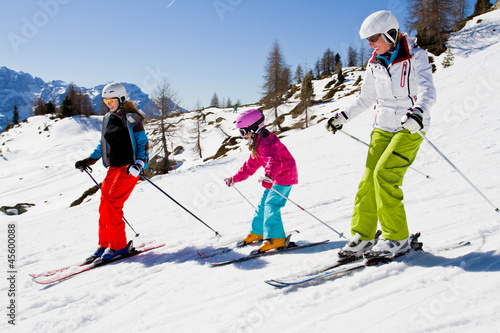 Skiing, winter, ski lesson - skiers on mountainside