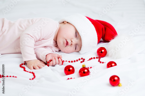 sleeping baby girl Santa Claus