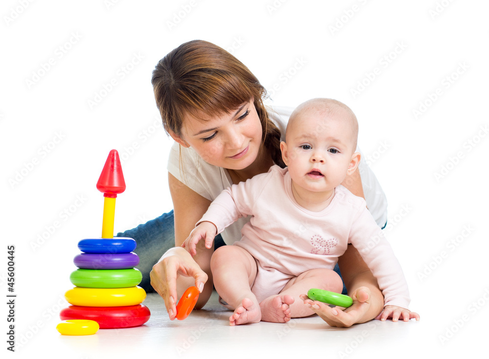 baby girl and mother playing together with construction set toy baby girl and mother playing together with construction set toy