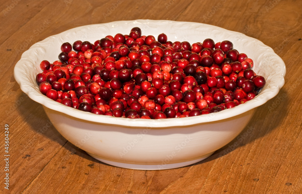 Cranberries on white plate Cranberries on white plate