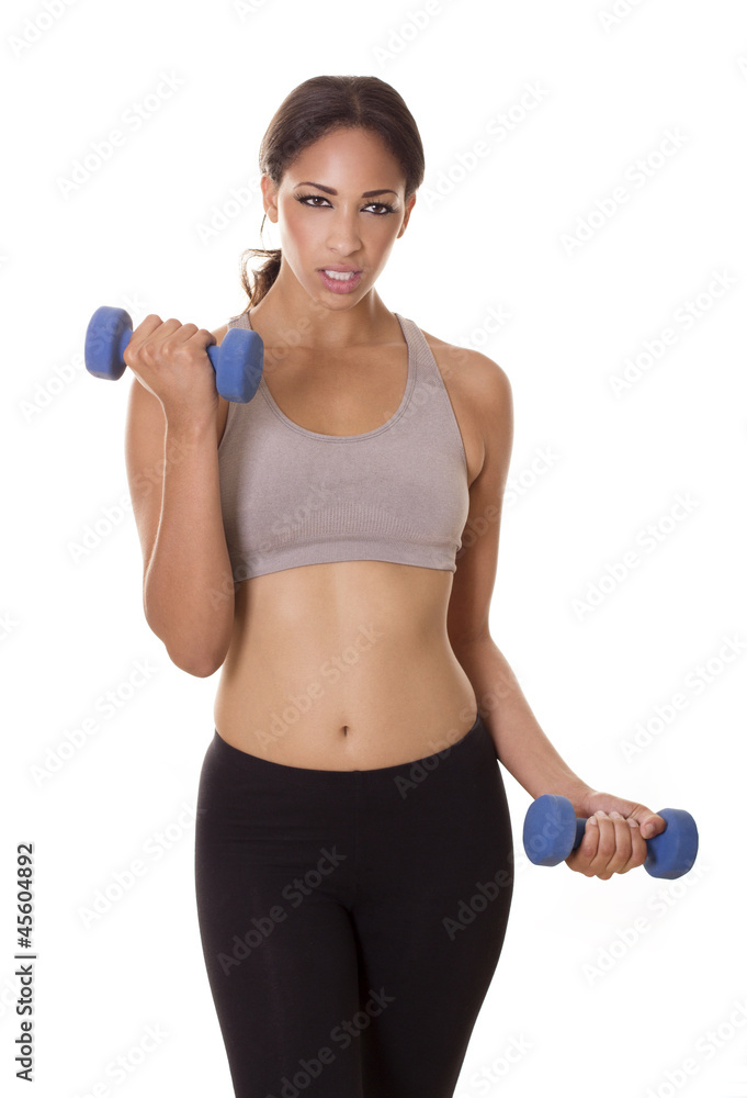Attractive woman concentrates on her workout. Attractive woman concentrates on her workout.