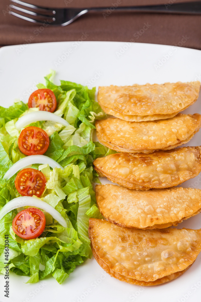 Tuna patties with lettuce salad in a plate