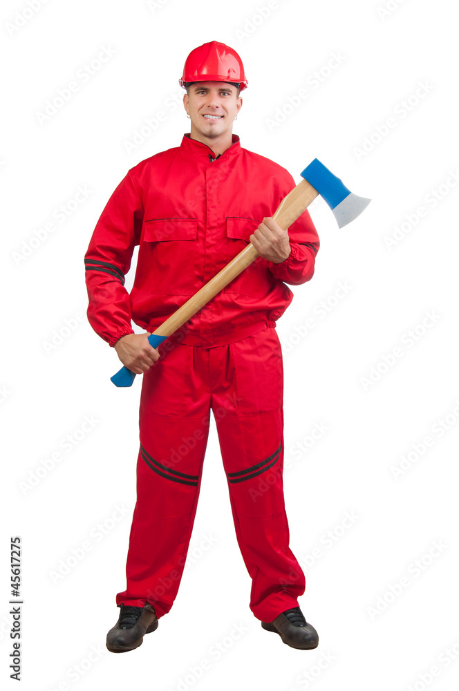 Young smiling fireman with hard hat, uniform holding huge ax Young smiling fireman with hard hat, uniform holding huge ax