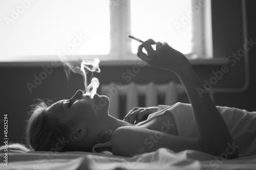 face beautiful girl smoking a cigarette
